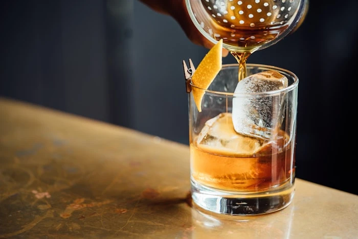 The Loft Hotel Bar — intimate bar with custom joinery and pendant lighting