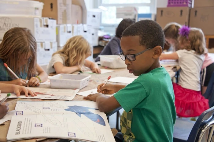 Students collaborating in a bright, modern classroom