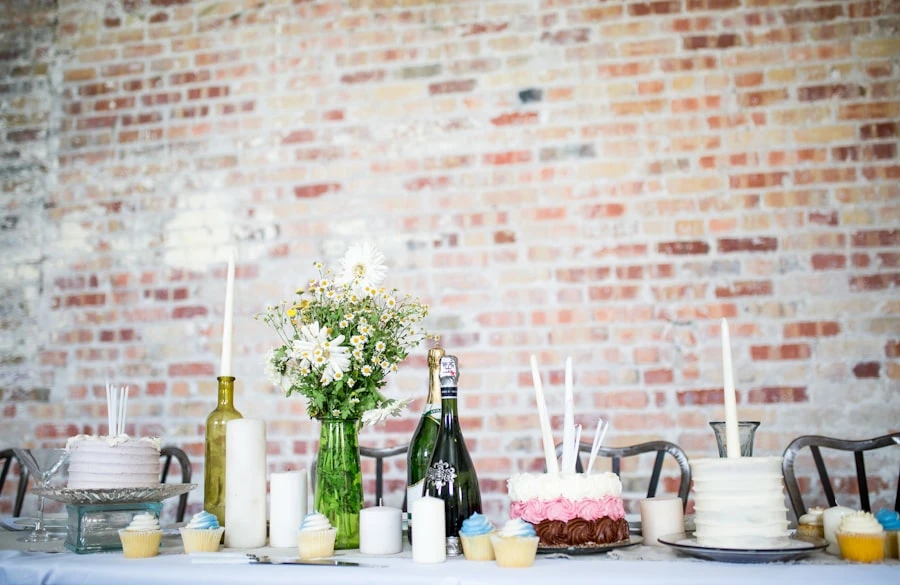 Elegant table setting with blush florals and gold candleholders