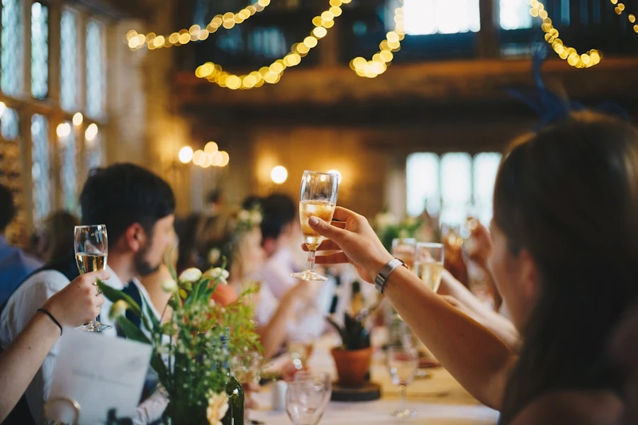 Reception hall transformed with candles and hanging greenery