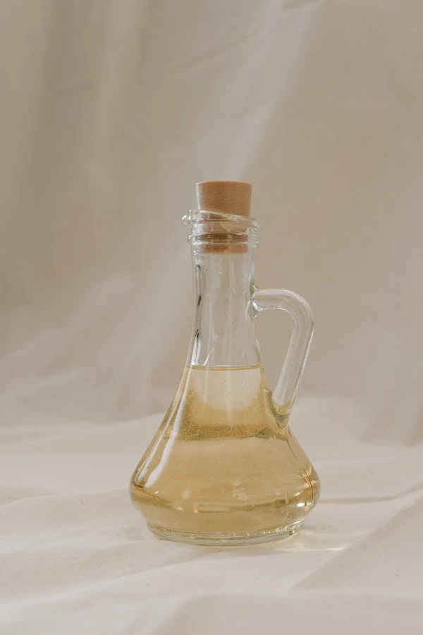 Extra-virgin olive oil bottle with olives