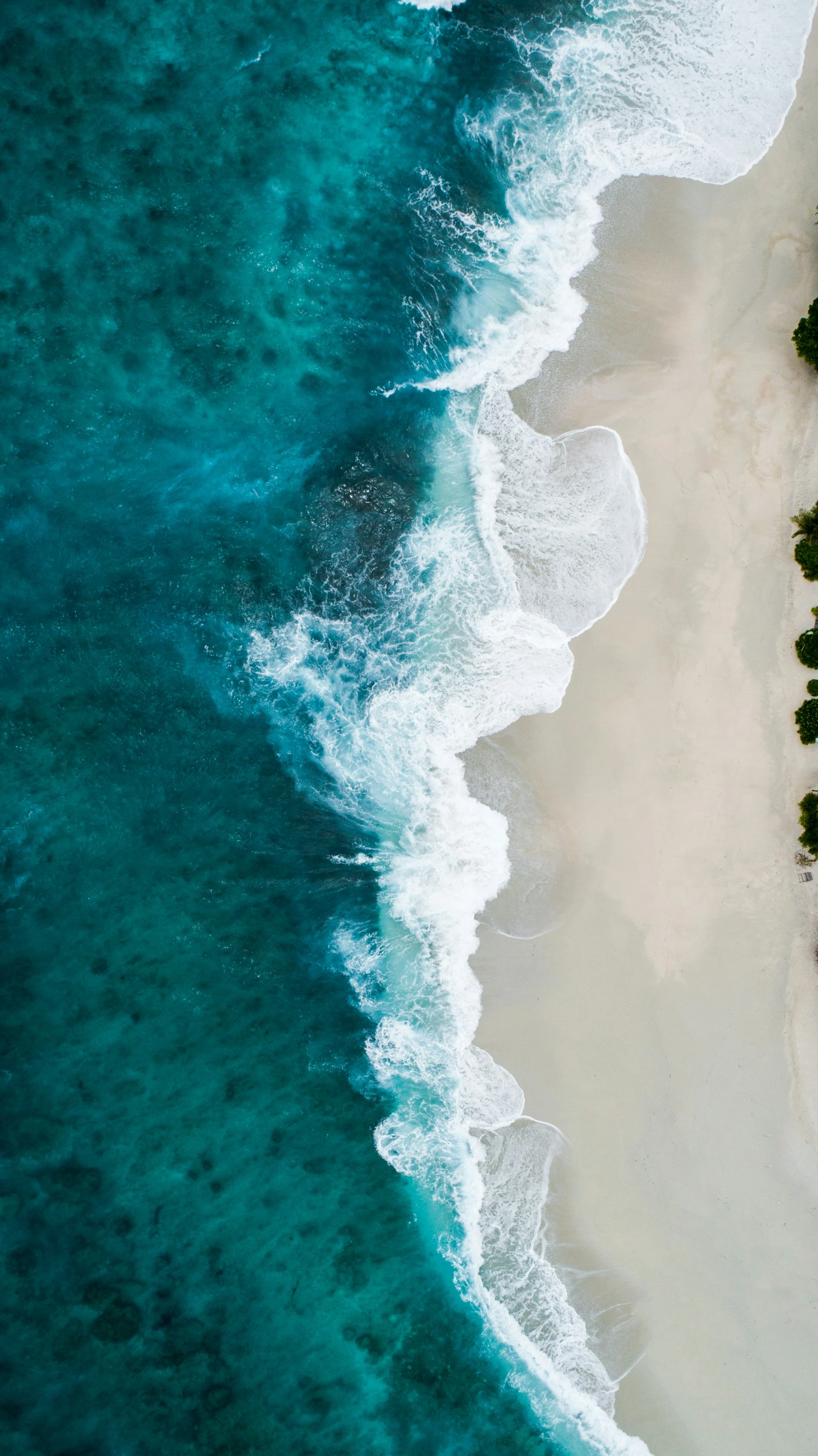 Aerial view of vast ocean waters at sunrise