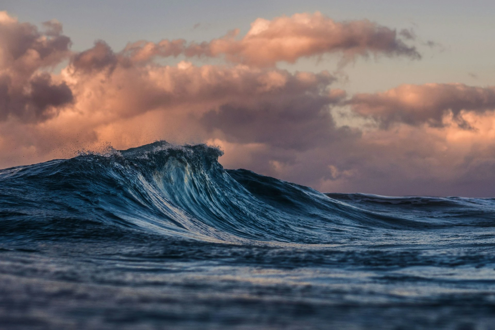 Commercial fishing vessel at sea during golden hour