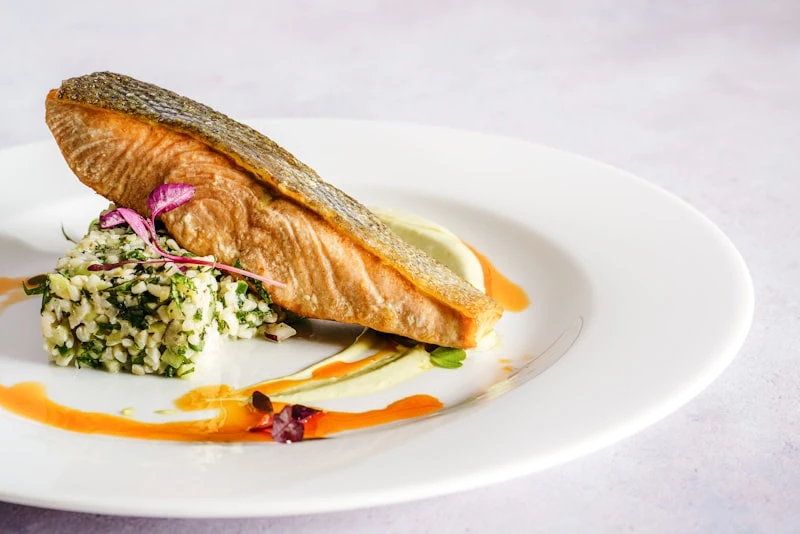 Fresh salmon fillets on cutting board