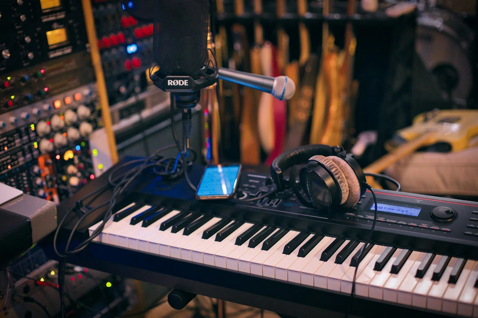 The SoundCraft studio — mixing console, acoustic panels, and studio monitors