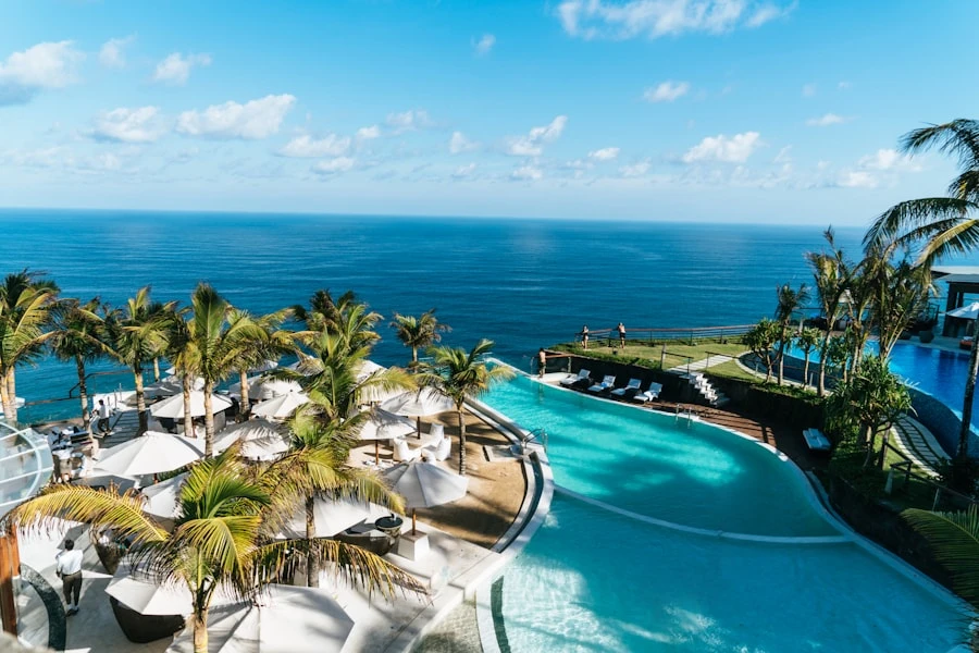 Seagrass Cove beachfront — palm trees, turquoise water, white villas