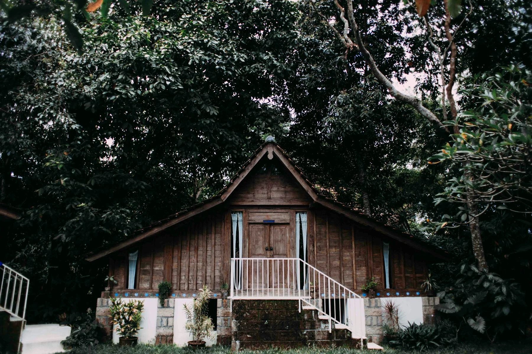 Heritage detail — the wooden bungalow exterior with stairs