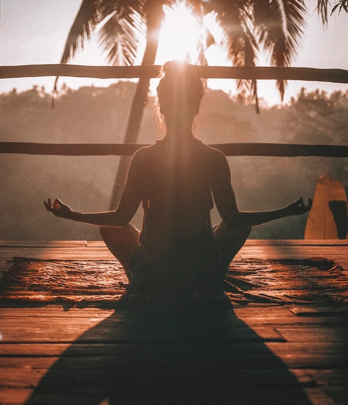 Private sunrise yoga session on a deserted beach