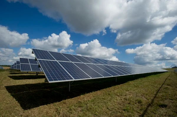 Solar panels against a bright blue sky