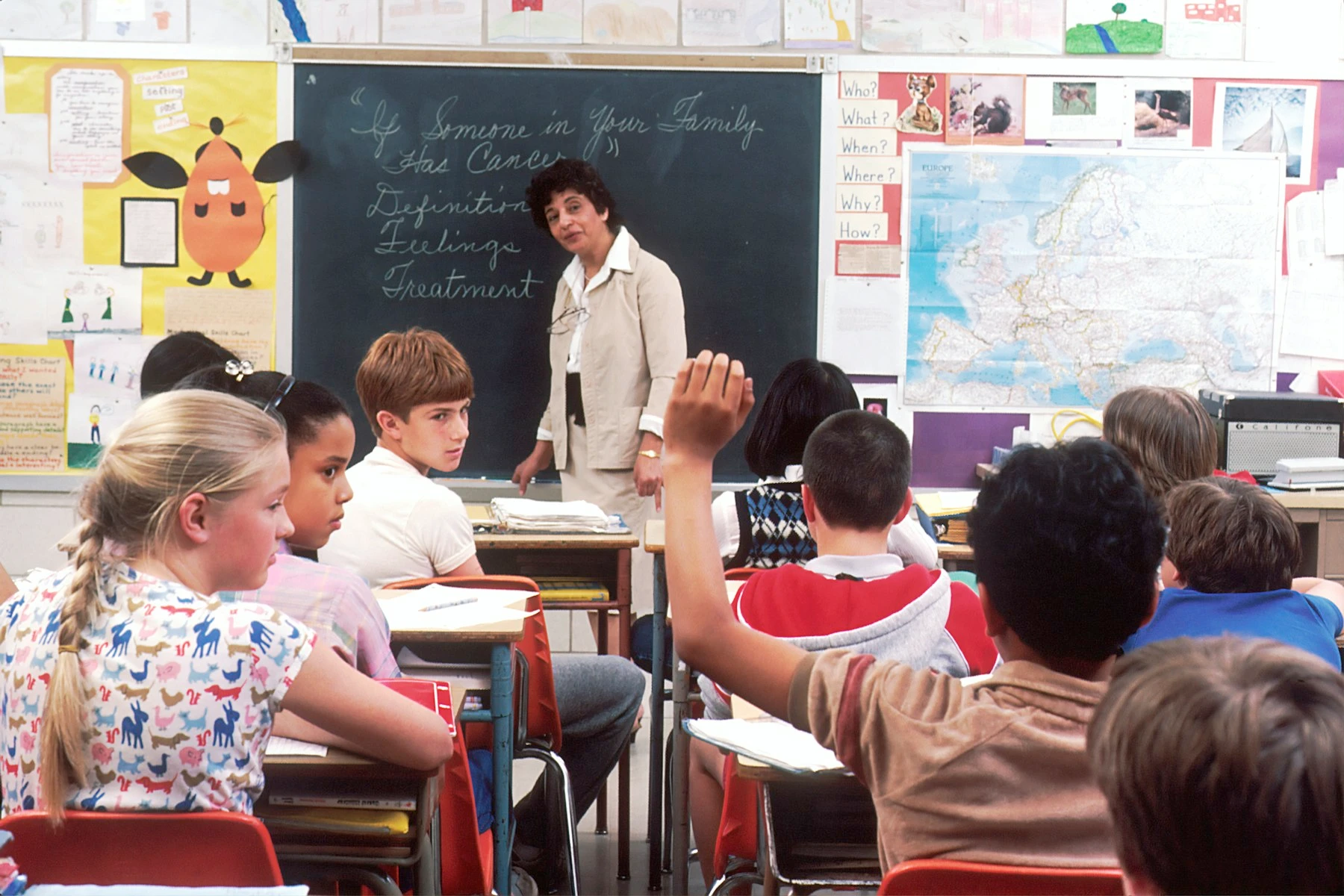 Teacher working with students in rural Africa