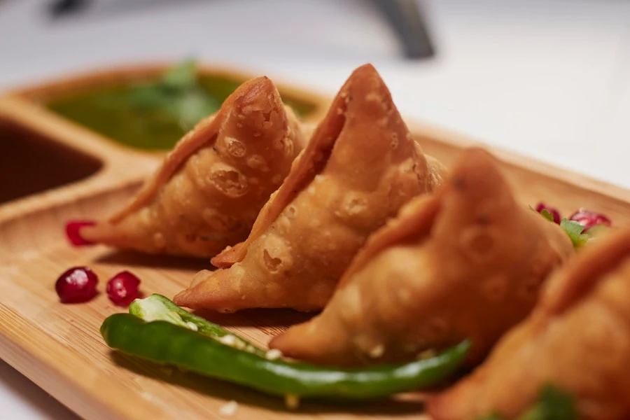 Samosa chaat with three chutneys and sev