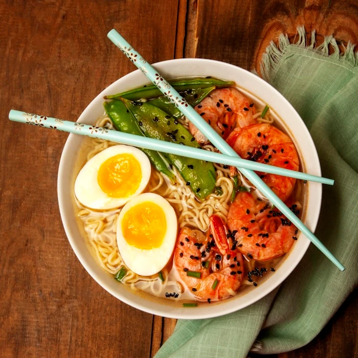 Dark aerial view of a steaming bowl of ramen at Kuro