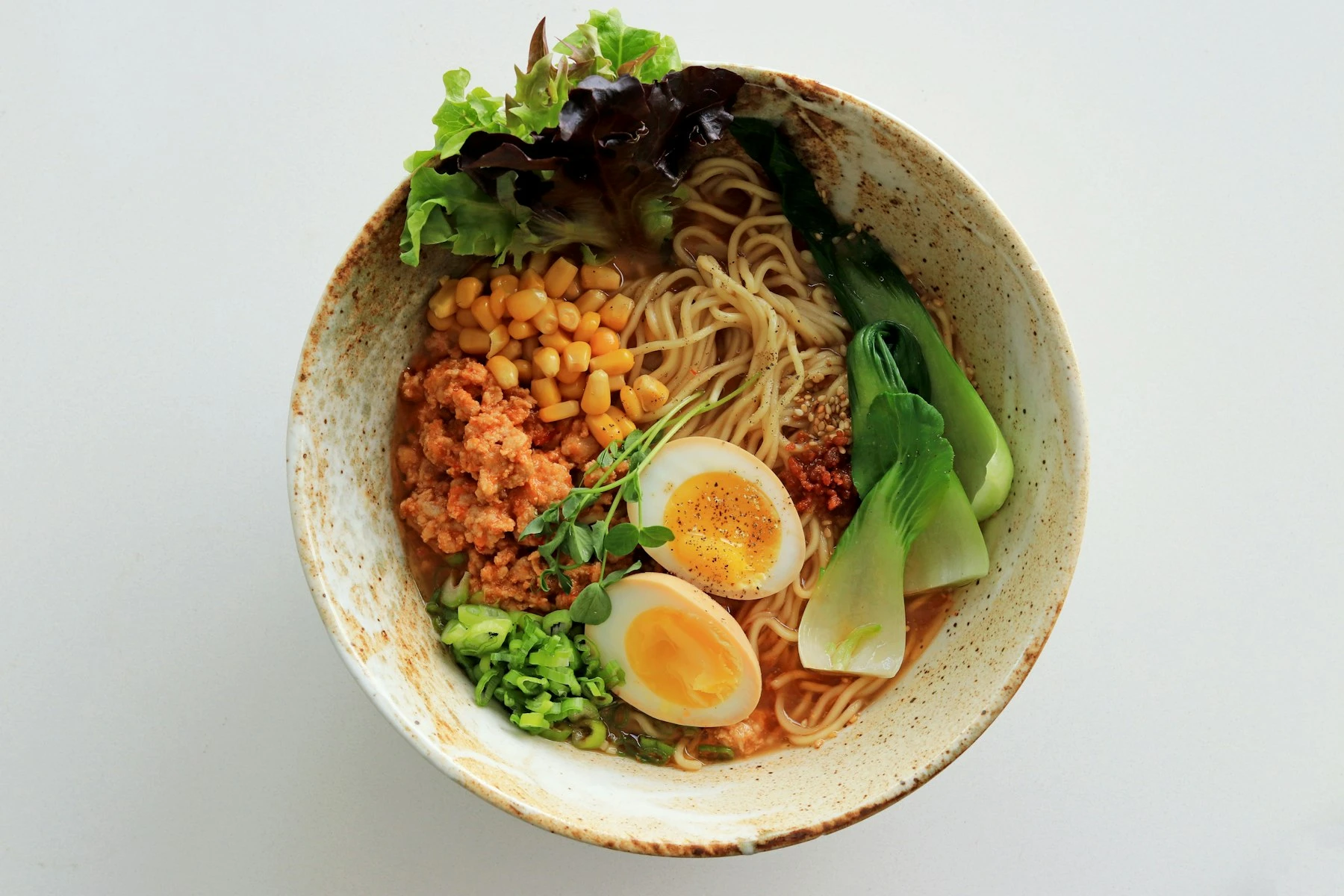 Close-up of a bowl of ramen with perfectly placed toppings