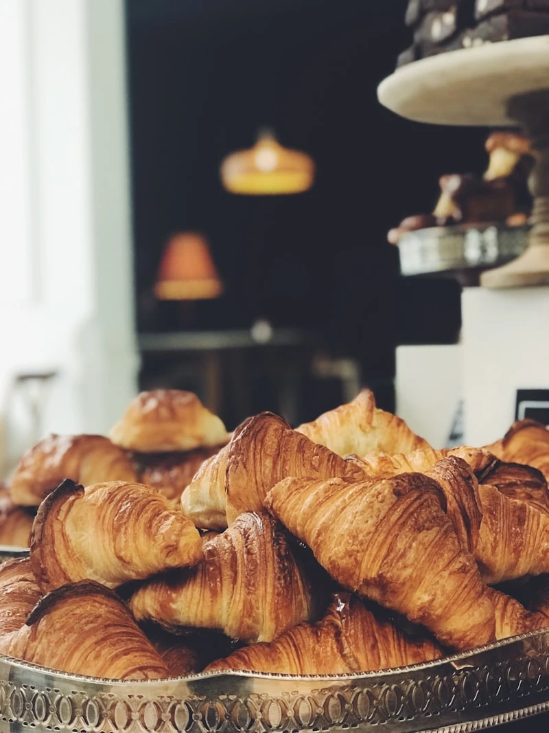Hands shaping croissant dough