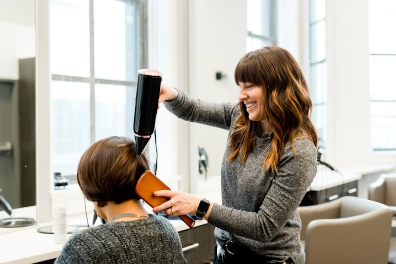 Beauty instructor guiding a student